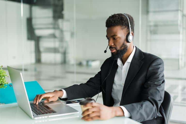 african american man customer support operator with hands free headset working office 768x513 1